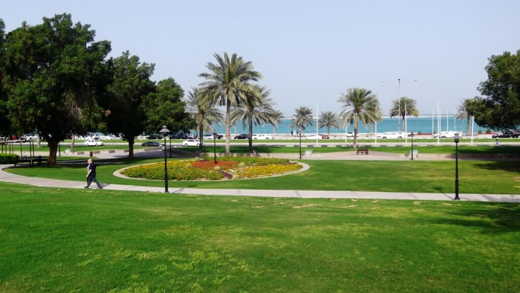 Lawns, palms and footpaths at Al Bidda Park beside the Corniche