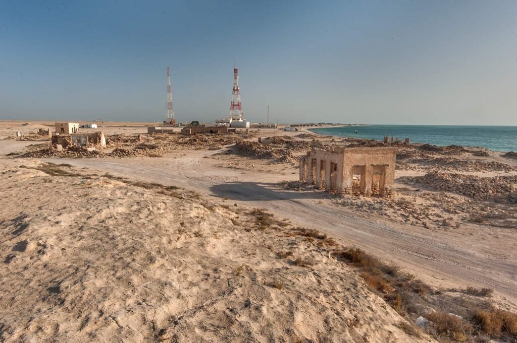 View from the rocky hill over the abandoned village of Al Ghariya towards the coast