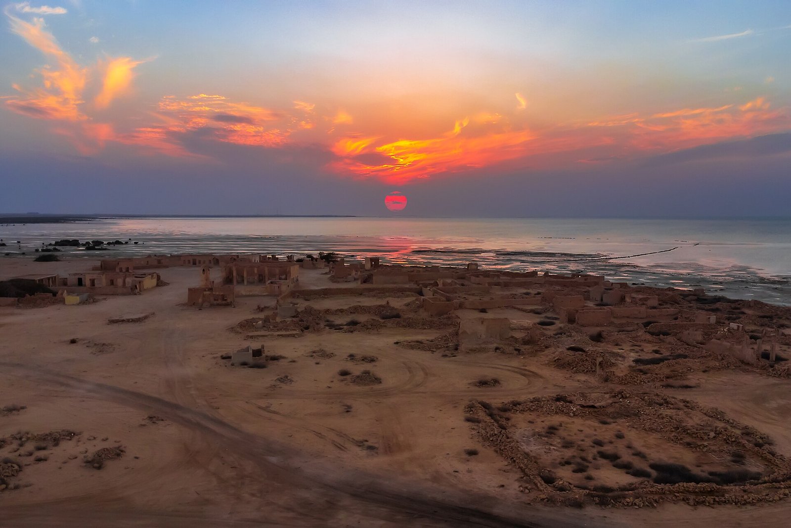 Aerial view of Al Jumail abandoned village at sunset on Qatar's north-west coast