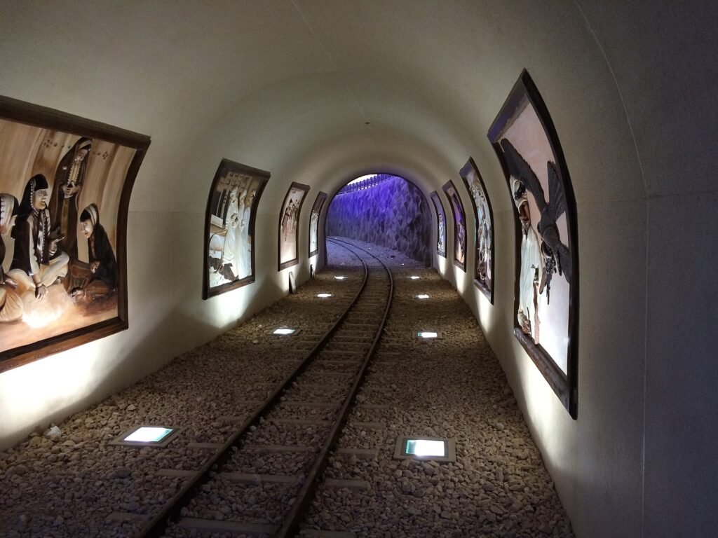 Decorated tunnel with rail track for the park train at Al Khor Park
