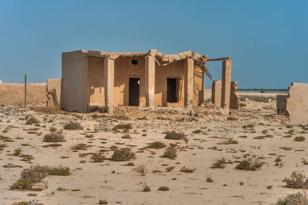 Roofless stone ruins of the abandoned village at Al Mafjar
