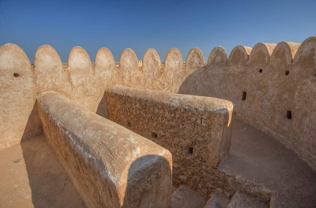 Crenellated parapet on the walls of Al Thaqab Fort