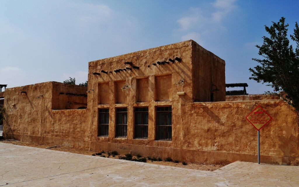 Traditional-style two-storey building with wooden windows in Al Wakrah Old Souq