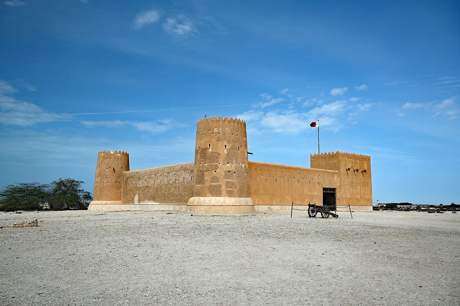 Al Zubarah Fort with its round corner towers under a blue sky, Al Shamal, Qatar