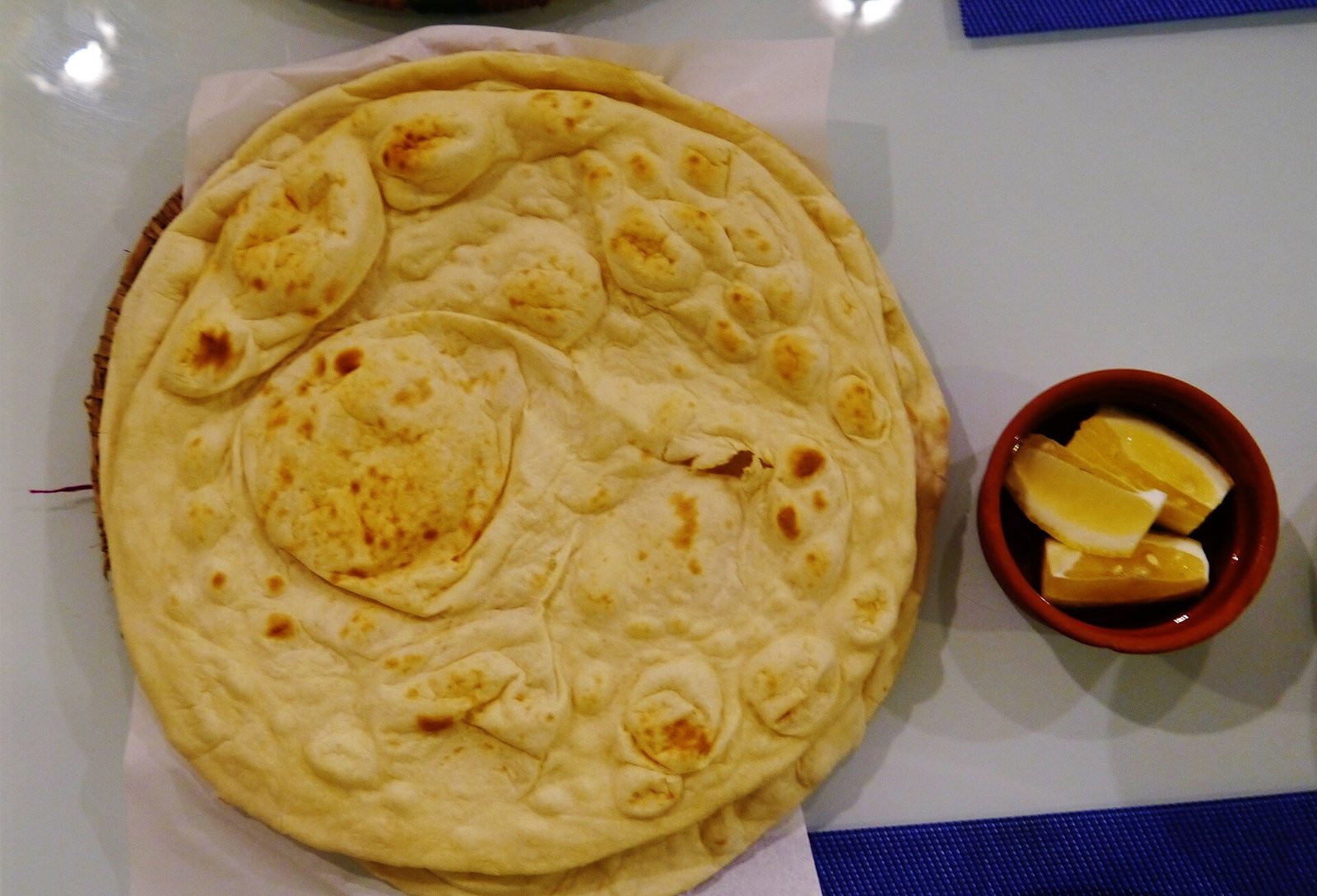 Freshly baked flatbread served at Bayt Sharq in Doha