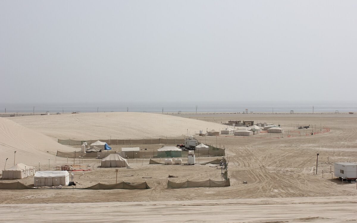 Tents and camp enclosures in the desert near Mesaieed, Qatar