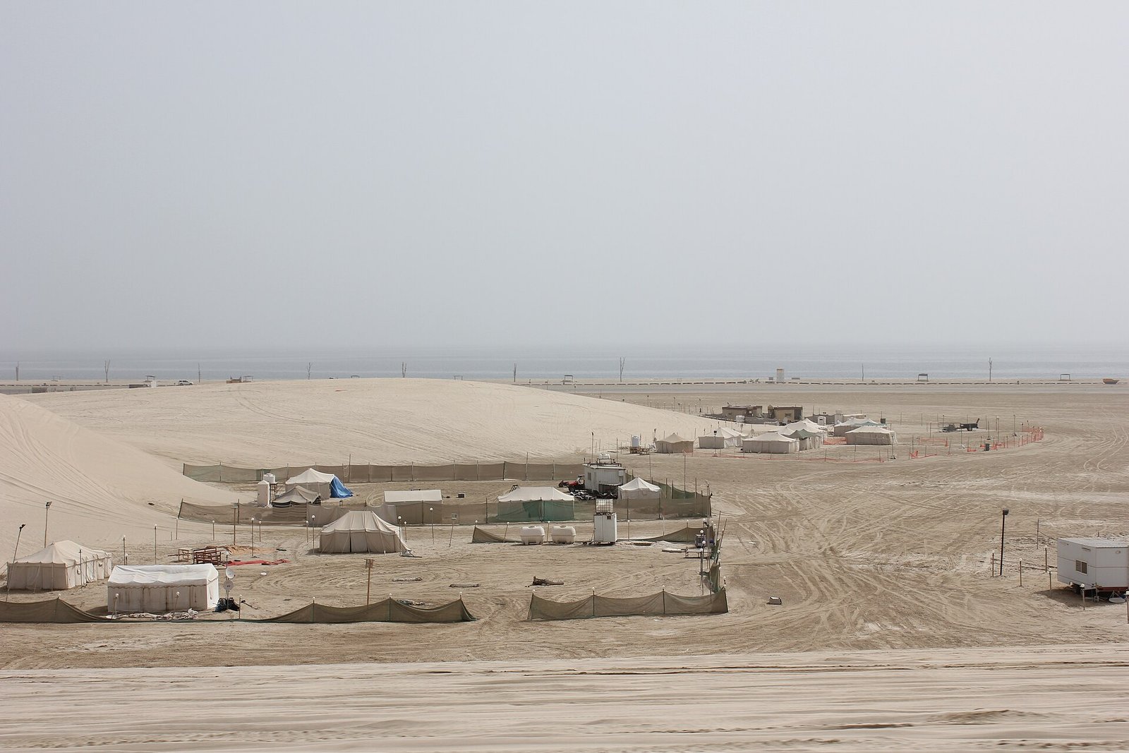 Tents and camp enclosures in the desert near Mesaieed, Qatar