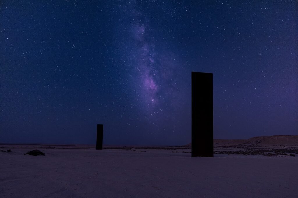 The Milky Way above one of the steel plates of East-West/West-East at night