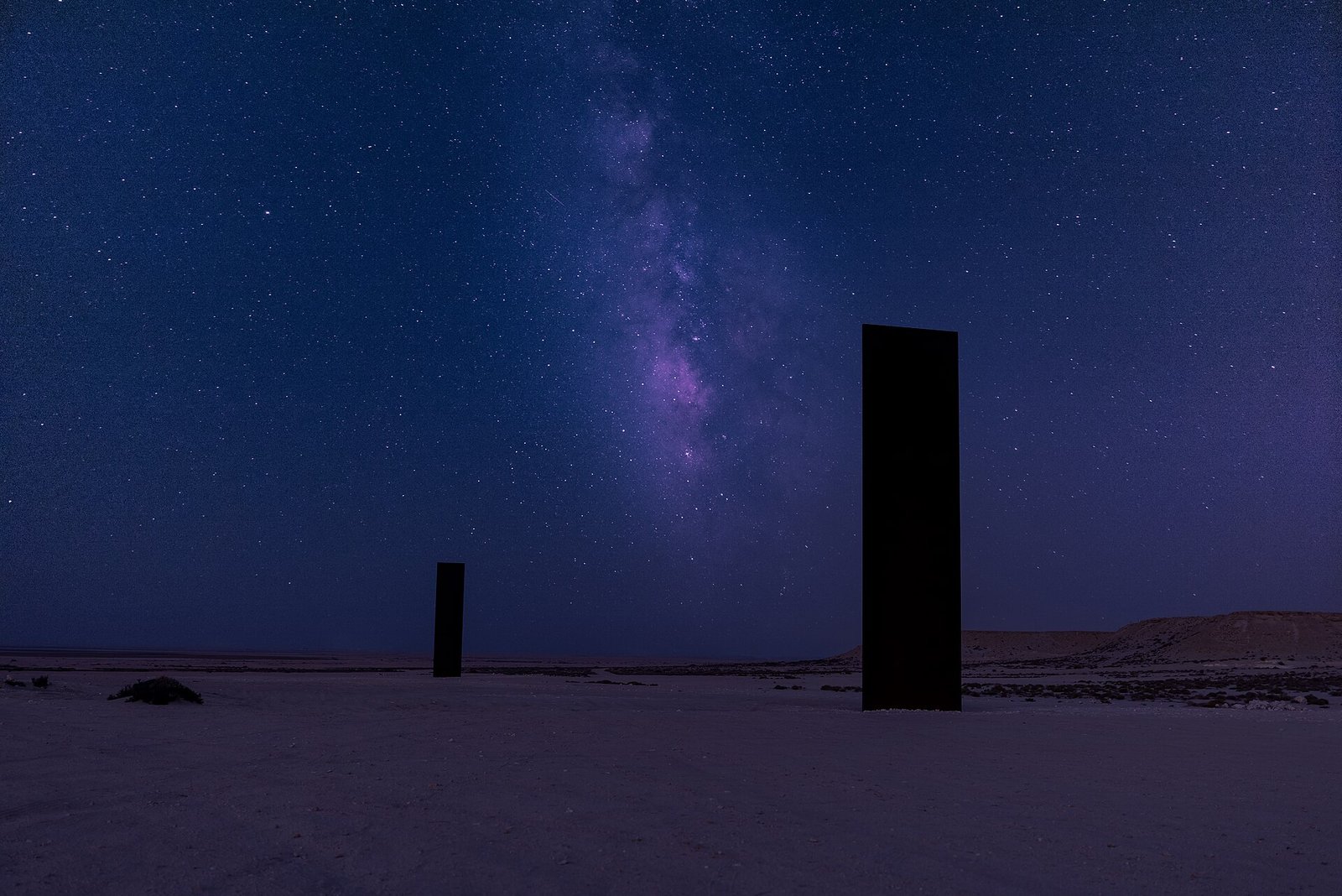 The Milky Way above one of the steel plates of East-West/West-East at night