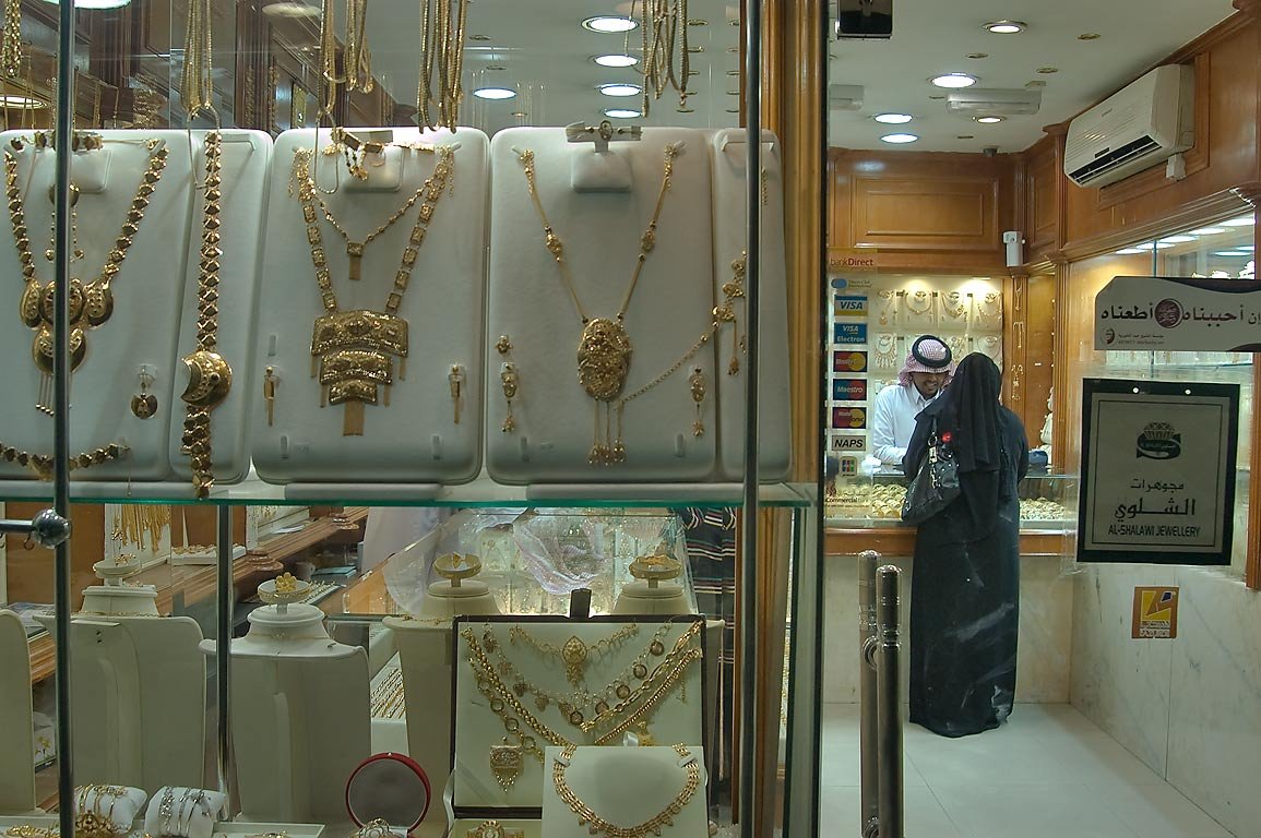 A shopper looking at jewellery inside a shop at the Gold Souq in Doha