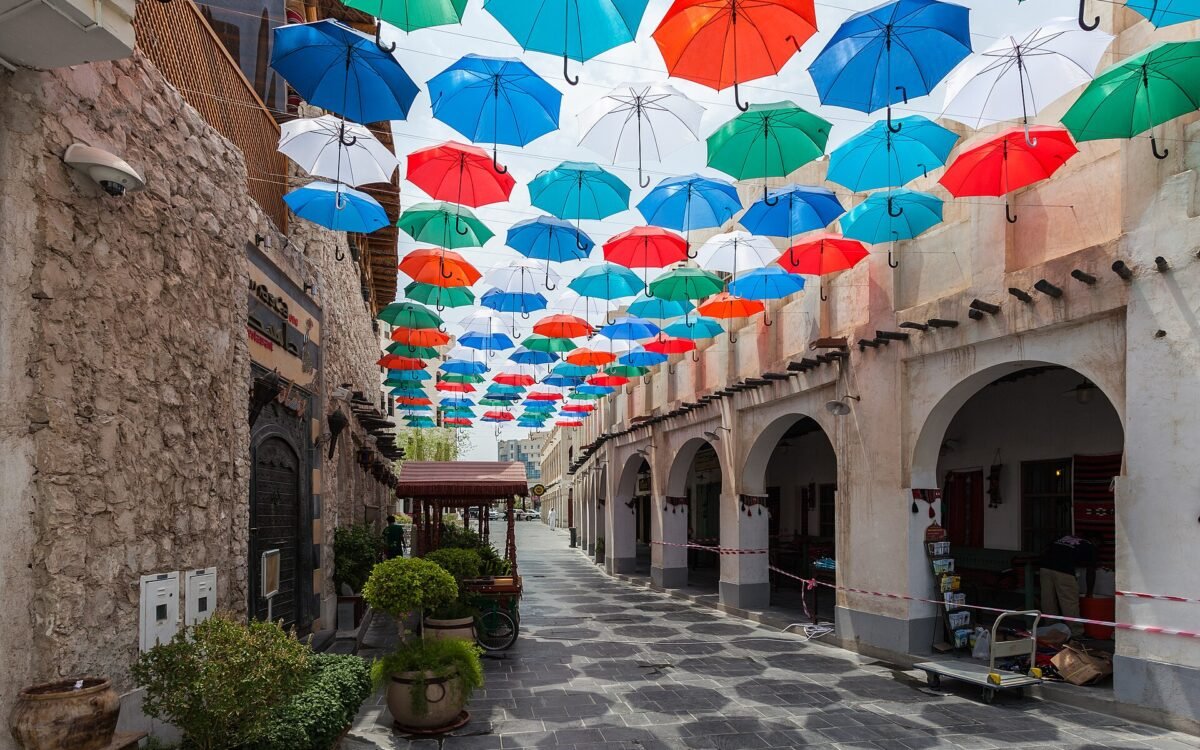 Colourful umbrellas shading a lane in Souq Waqif, Doha