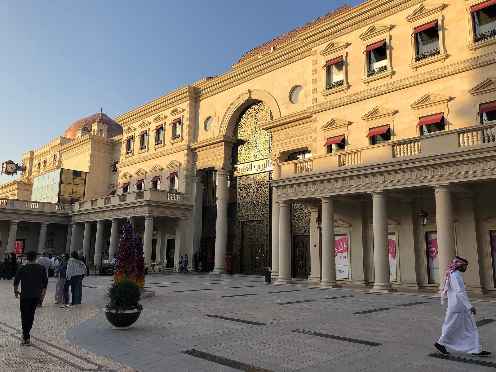 An ornate arched facade on a pedestrian street at Katara