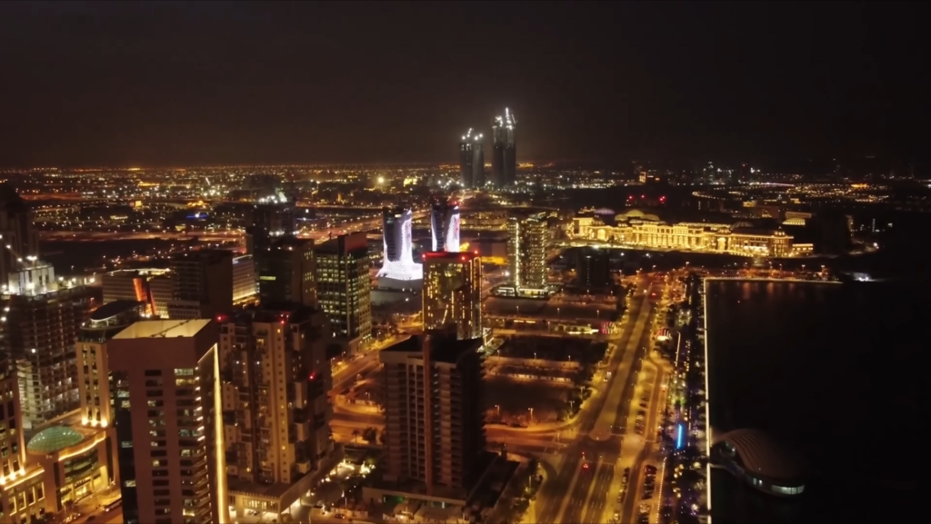 Aerial night view of Lusail skyscrapers and lit streets