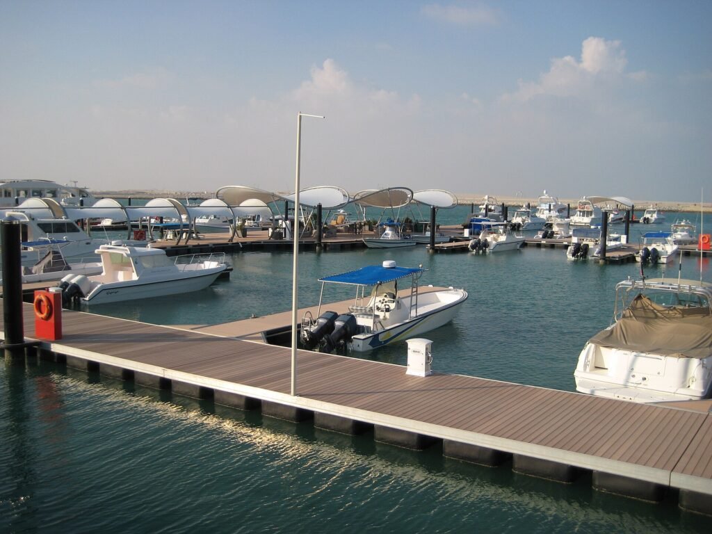 Boats moored at pontoons in Lusail Marina