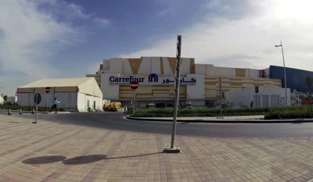 Street-level view of the Mall of Qatar exterior and the Carrefour entrance in Rawdat Al Jahhaniya
