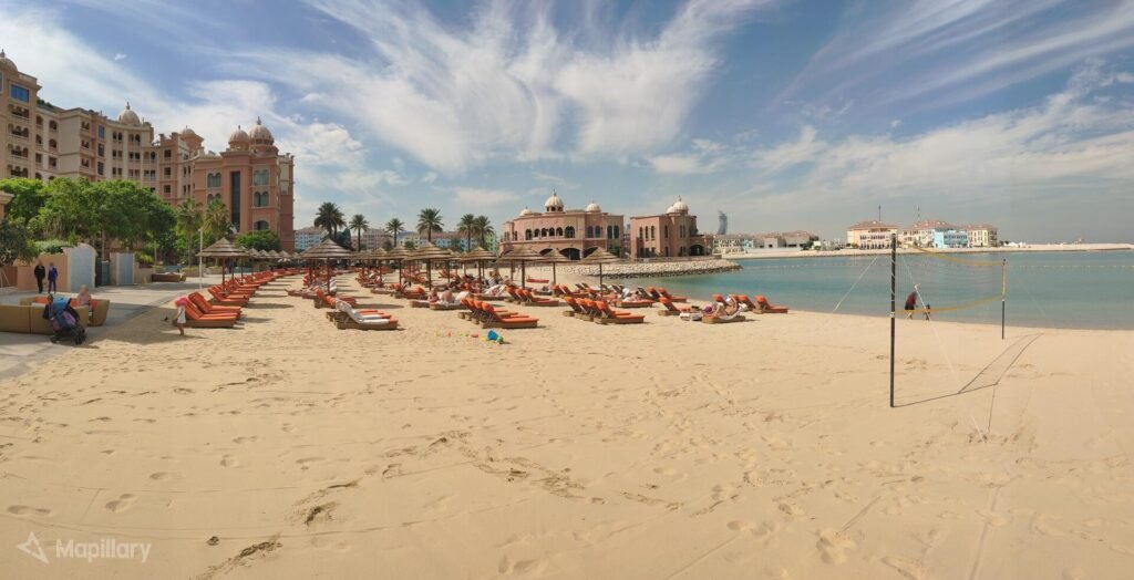 Sun loungers and umbrellas on the private beach at Marsa Malaz Kempinski