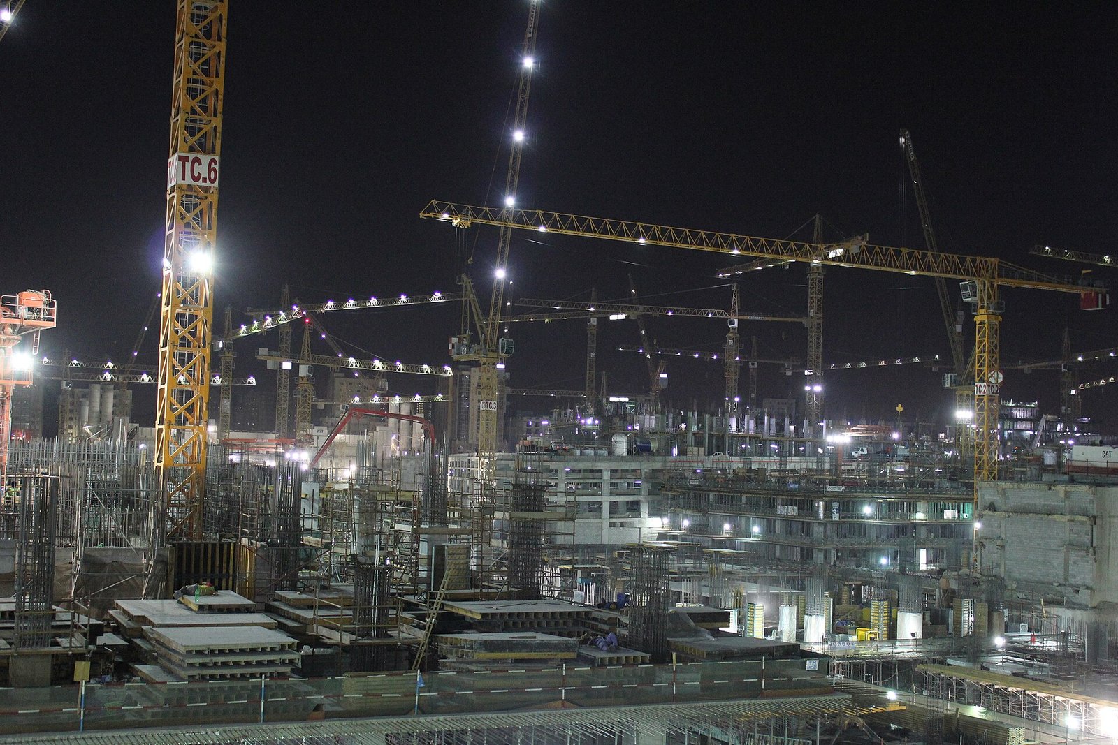 Cranes and floodlights over the Msheireb Downtown Doha construction site at night in 2013