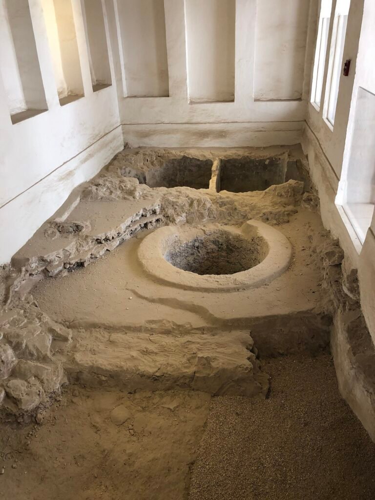Archaeological excavation displayed under glass inside Radwani House, Msheireb Museums