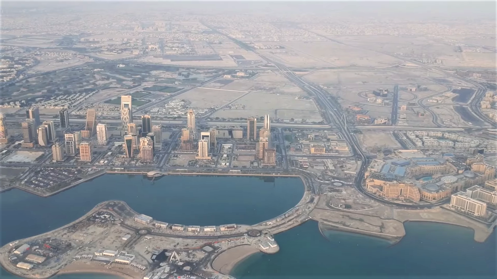 Aerial view of Lusail with Place Vendôme mall on the right and the Qetaifan Islands in the foreground