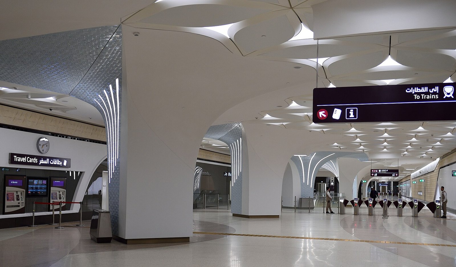 Inside a modern Doha Metro station with white curved arches