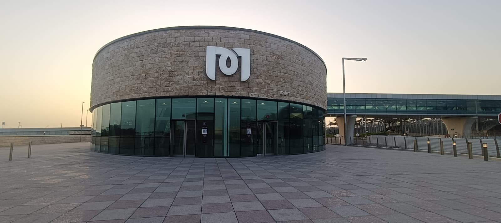 The round stone entrance of the Hamad International Airport metro station