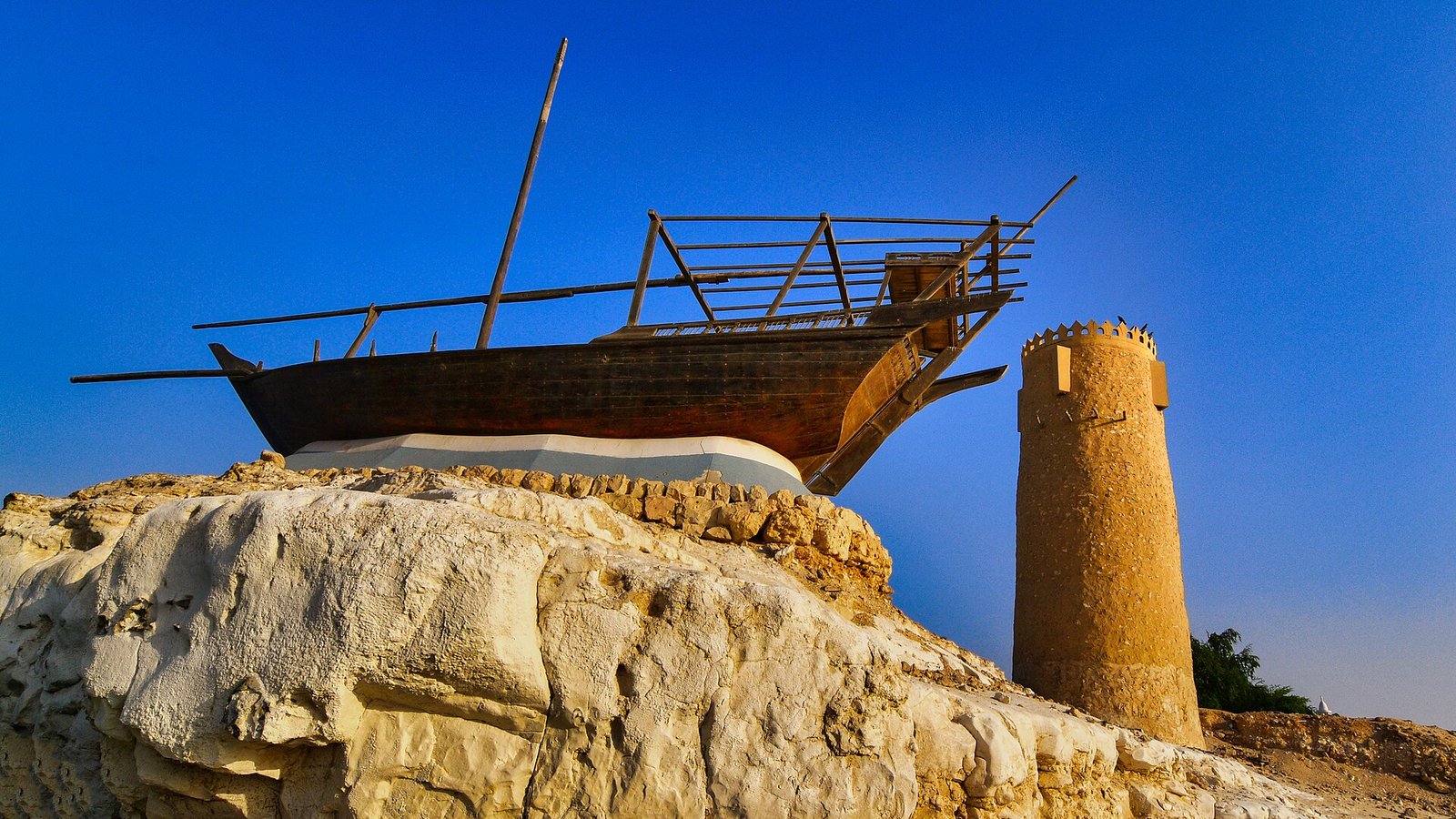 Replica dhow beside one of the Al Khor Towers