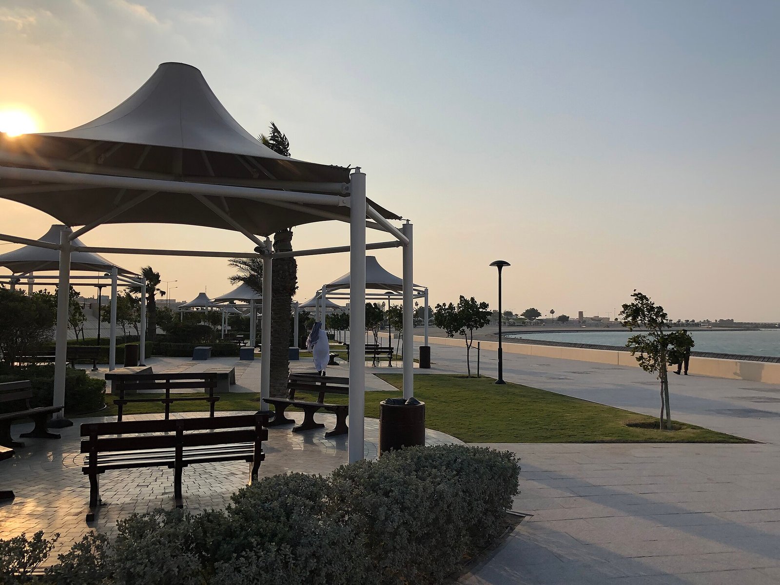 Shaded seating and promenade on Al Khor Corniche