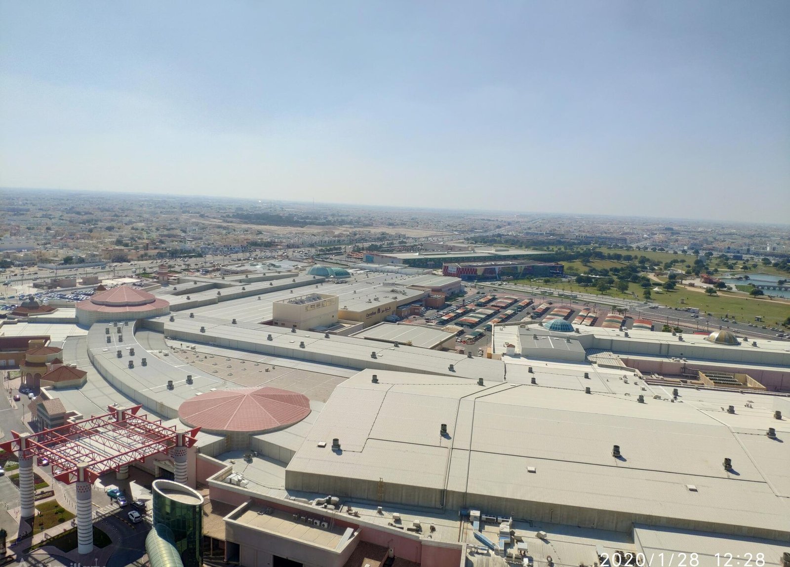 Overhead view of Villaggio Mall roof with Aspire Park and Al Aziziya beyond
