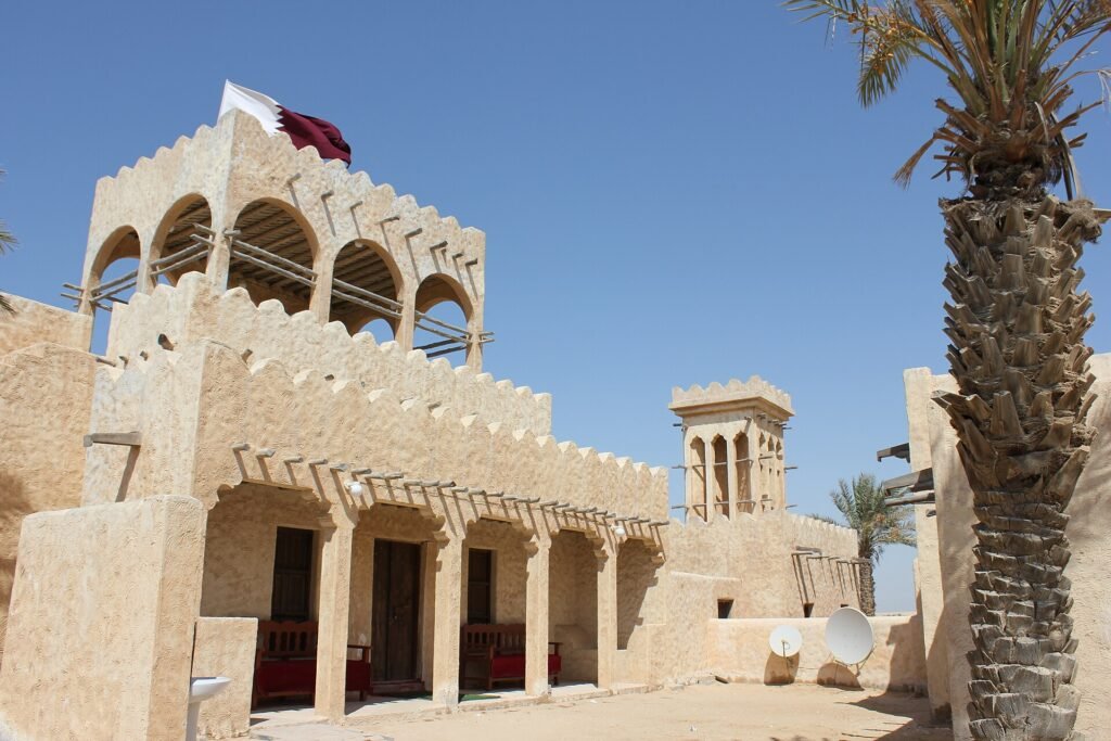 Arched balconies and a watchtower inside the Zekreet Film City set