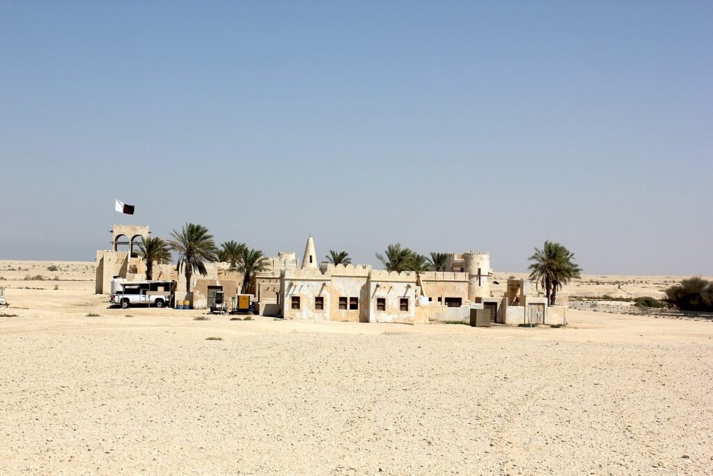 Film City seen from a distance across the flat Zekreet desert